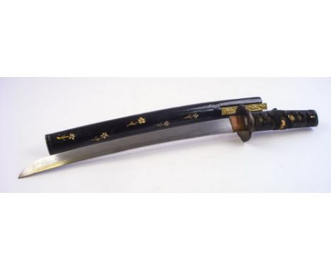 A  Japanese wakizashi:, signed to the tang, the 14 1/2 inch blade with copper habaki and plain quartrofoil tusba, over a blac