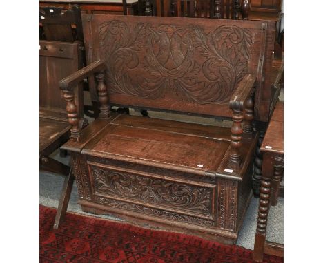 A Carved Oak Monks Bench, 99cm by 46cm by 110cm high (open)