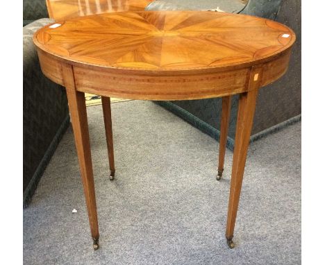 An Edwardian Satinwood Oval Lamp Table, with patera inlay and crossbanding, 78cm by 55cm by 73cm, together with an Anglo-Indi