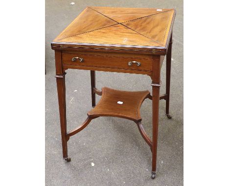 A Cross-banded Mahogany Envelope Card Table, and a mahogany dwarf revolving bookcase, bearing ivorine label for Francis Lynn 