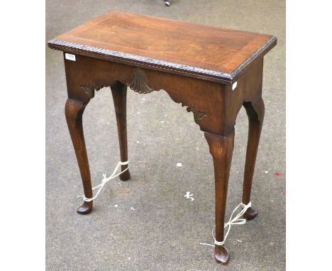 A 1920's Walnut Gateleg Card Table, 63cm by 32cm by 71cm; together with a late 19th century/early 20th-century mirror, 77cm b