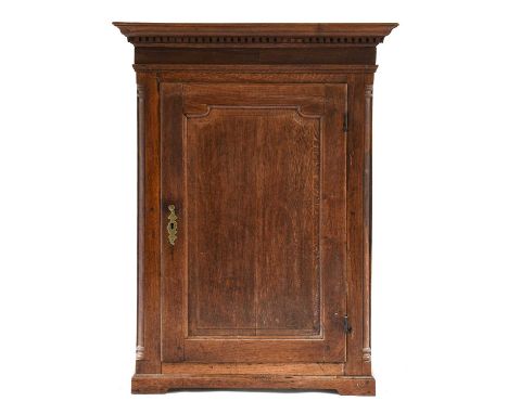 A George II Oak Wall Mounted Straight Fronted Hanging Cupboard, 2nd half 18th century, the moulded cornice above a plain frie