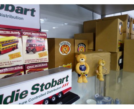 A COLLECTION OF BAD TASTE BEARS IN ORIGINAL BOXES, AND A DISPLAY SHELF, A QUANTITY OF DIE CAST VEHICLES AND A WINE RACK.