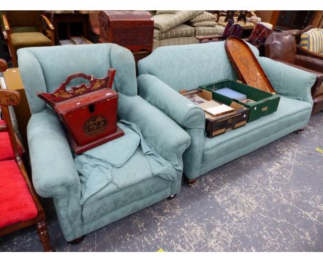A TWO SEATER SOFA AND A SIMILAR WINGED BACK ARMCHAIR. 