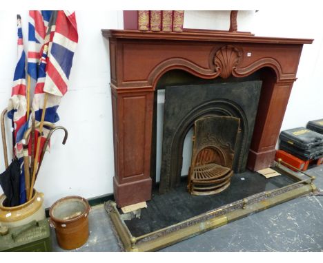 A MAHOGANY FIRE SURROUND AND A CAST IRON FIREPLACE.