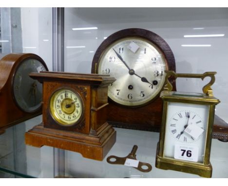 A BRASS CASED CARRIAGE CLOCK AND THREE MANTLE CLOCKS. 