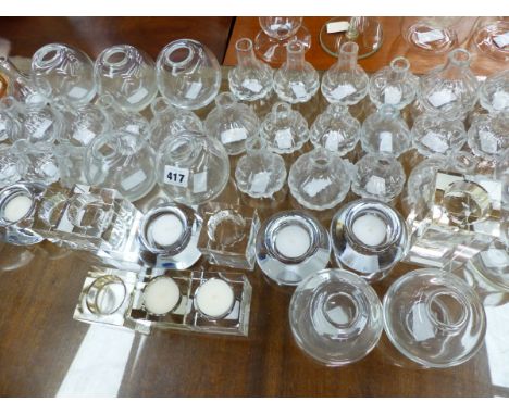 A QUANTITY OF GLASS BUD VASES AND TEA LIGHT STANDS. 