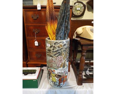 An Oriental Ceramic Stick Stand containing Umbrellas (AF).