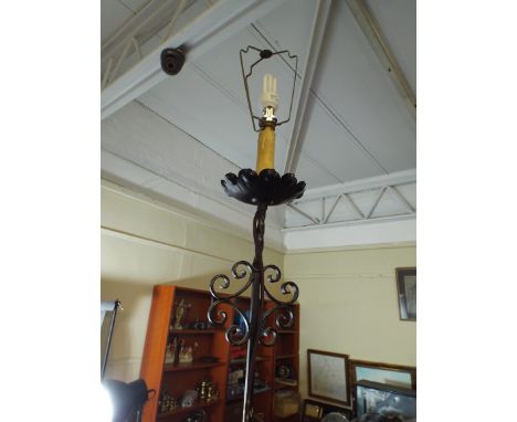 A Wrought Iron Standard Lamp with Tripod Base.