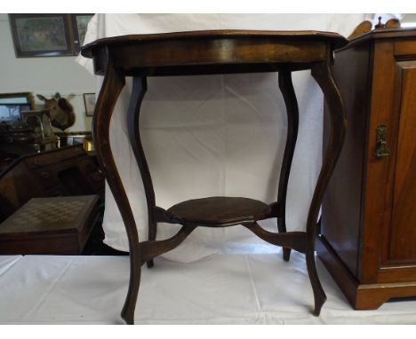 An Edwardian Oval Occasion Table with Stretcher Shelf.