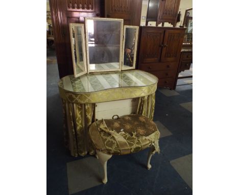 A Kidney Shaped Cream and Gilt Dressing Table and Stool. 