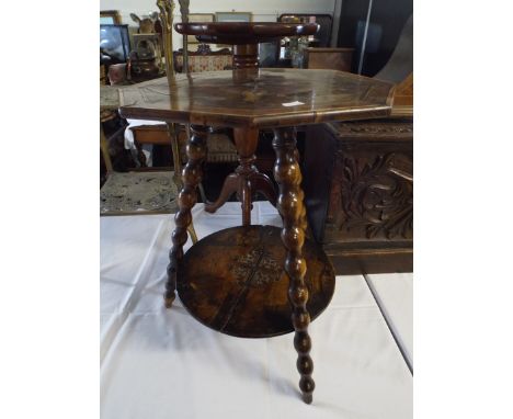 An Eastern Olive Wood Octagonal Table Inscribed Jerusalem with Bobbin Tripod Supports and Stretcher Shelf.                   