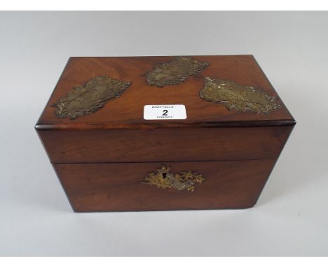 A Walnut Two Division Tea Caddy with Brass Decorative Mounts.