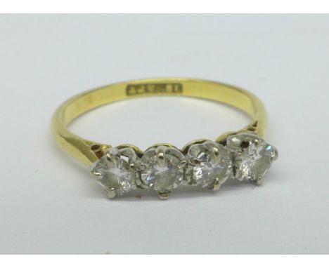 An 18ct gold, four stone diamond ring, 1.8g, K