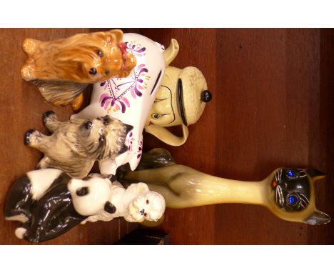 A 1960's long neck cat, Arthur Wood piggy bank, three Sylvac dogs, one a/f, a Russian model of a polar bear and a sad dog tea