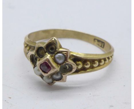 A 19th Century 10ct gold ring, lacking four seed pearls, 1.6g, K