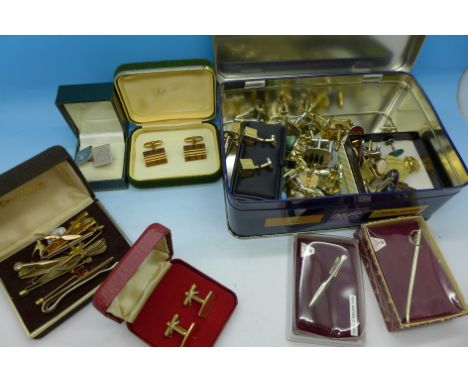 A quantity of tie pins and cufflinks, some boxed