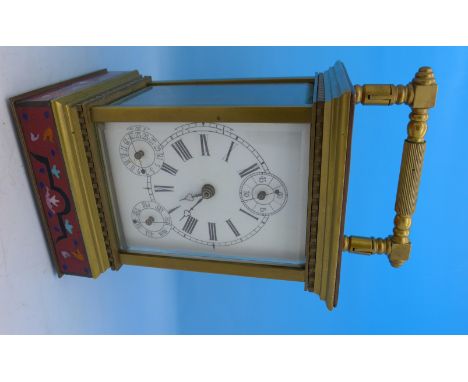 A brass and cloisonne carriage clock with day and date, height with handle 19cm