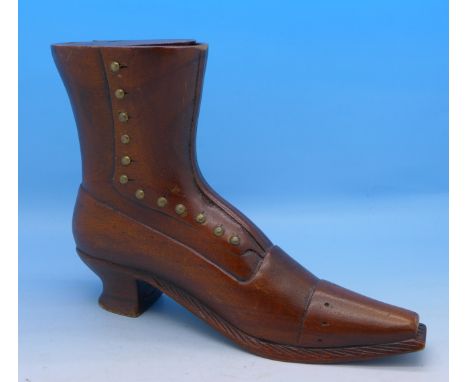A carved wooden shoe snuff box or inkwell