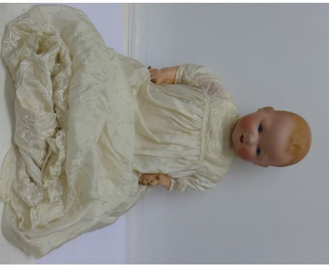 An Armand Marseille doll, marked A.M. Germany 351/8.K, composition body, right hand missing little finger