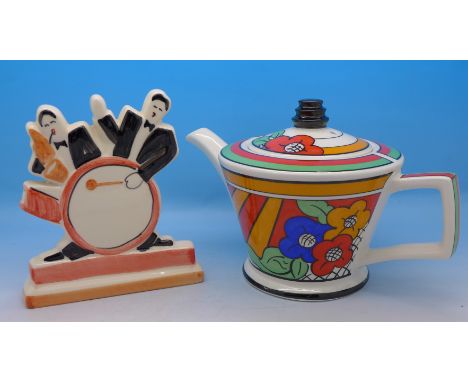 A Clarice Cliff style Bizarre Ware Past Times teapot and a Past Times jazz figure