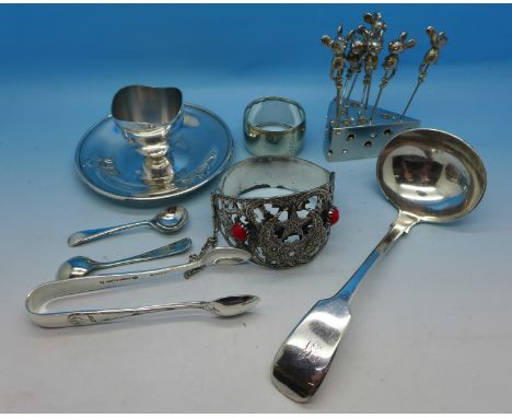 A ladle, a child's egg cup, a large bangle, cocktail sticks, etc.