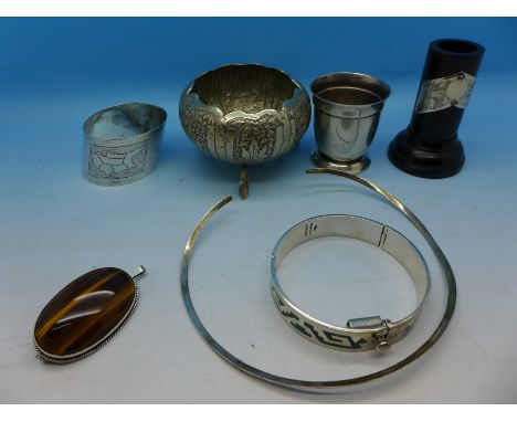 Silver and white metal items including a bangle, a tigers eye set pendant/brooch, egg cup, bowl, collarette, etc.