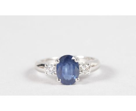 A GOOD 18CT WHITE GOLD THREE STONE SAPPHIRE AND DIAMOND RING.