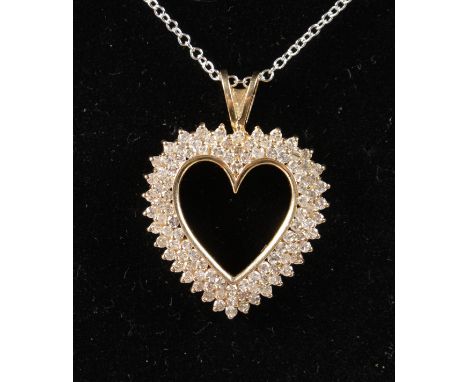 A LOVELY 14CT YELLOW GOLD DIAMOND SET HEART SHAPED PENDANT ON CHAIN.