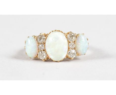 A GOOD 18CT YELLOW GOLD, OPAL AND DIAMOND RING.