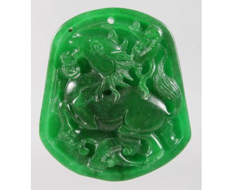 A CARVED APPLE GREEN JADE TABLET. 2ins.