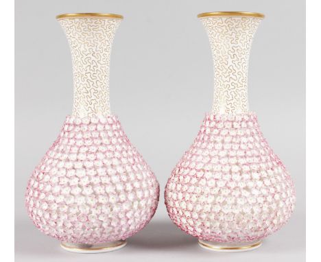 A PAIR OF ROYAL WORCESTER FLOWER ENCRUSTED BULBOUS VASES encrusted with flower heads. Printed circular mark. 7.5ins high.