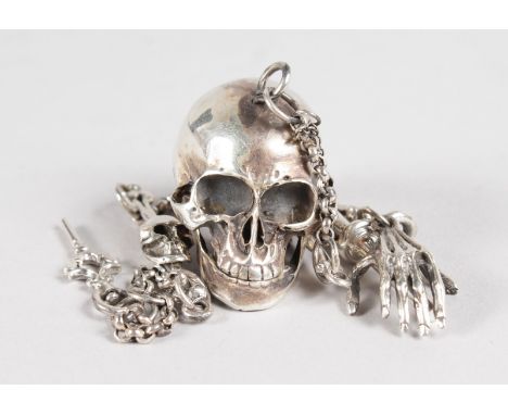 A SILVER SKULL SNUFF BOX on a skull and bone chain.