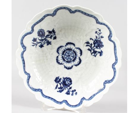 AN 18TH CENTURY WORCESTER JUNKET DISH with rare bamboo moulding decorated with underglaze blue flowers, two slightly stained 