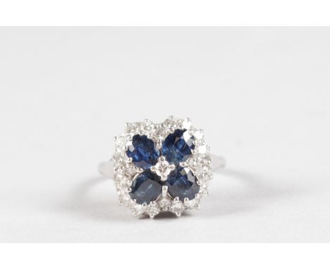 A GOOD 18CT WHITE GOLD SAPPHIRE AND DIAMOND SQUARE CLUSTER RING.