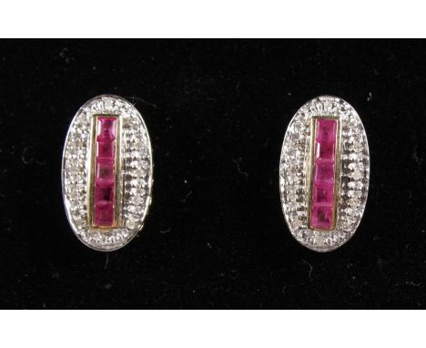 A PAIR OF ART DECO STYLE DIAMOND AND RUBY EARRINGS.