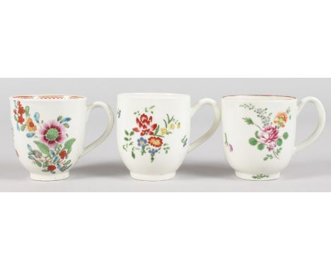 AN 18TH CENTURY WORCESTER COFFEE CUP painted with scattered florals spray under a brown line rim, a Worcester coffee cup with