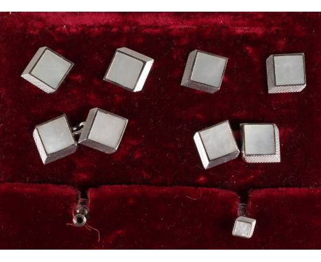 A SET OF 9CT WHITE GOLD AND MOTHER-OF-PEARL CUFFLINKS AND STUDS. Provenance: GARRARD, in original box.