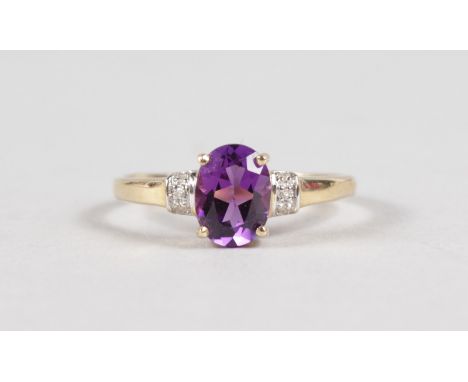 A 9CT YELLOW GOLD, AMETHYST AND DIAMOND RING.