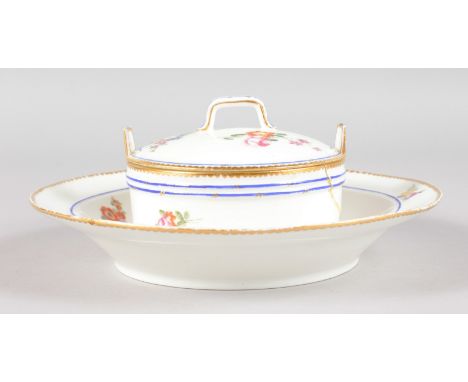 AN 18TH CENTURY SEVRES RARE BUTTER TUB AND COVER painted with flowers under a blue line and dentil gilt border, date code K f