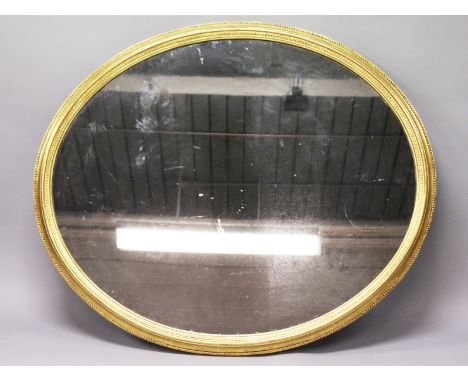 A LARGE GEORGIAN OVAL MIRROR with gilt wood frame. 3ft 8ins wide, 3ft 2ins high.