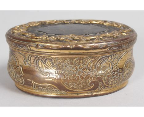 AN 18TH CENTURY CONTINENTAL GILT METAL AND TORTOISESHELL SNUFF BOX with scrolled and floral decoration. 8.5cms wide.