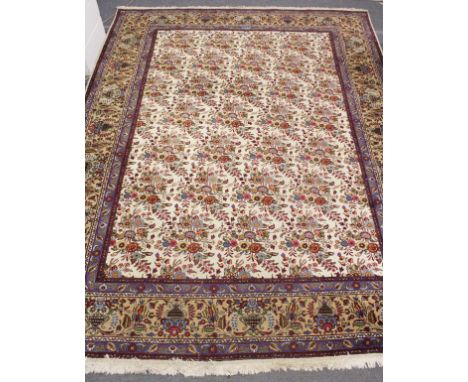 A PERSIAN DESIGN CARPET, cream ground with floral decoration within a similar beige ground border. 13ft 0ins x 9ft 8ins.