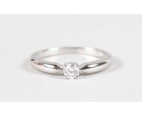 AN 18CT WHITE GOLD SOLITAIRE DIAMOND RING of 25 points.