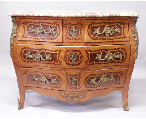 A GOOD LOUIS XVI STYLE KINGWOOD BOMBE FRONTED COMMODE, with veined marble top, two short and two long inlaid graduated drawer