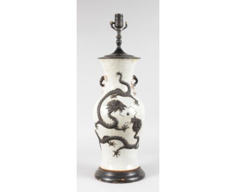A LARGE CHINESE CRACKLE GLAZE VASE with dragon decoration, converted to a lamp. 19ins high.