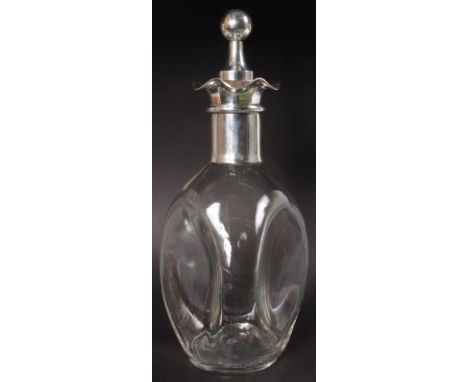 A GLASS DIMPLE DECANTER with plated mounts.