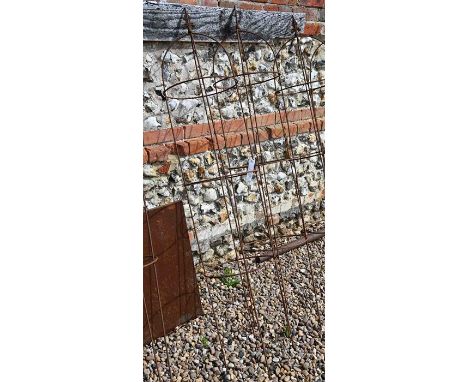 A pair of weathered steel arrow-head garden obelisks, approx. 160 cm high x 33 cm diameter 