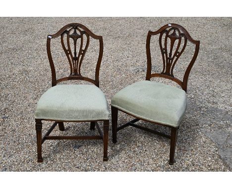 A pair of Hepplewhite style carved mahogany side chairs, light green dralon upholstered seats