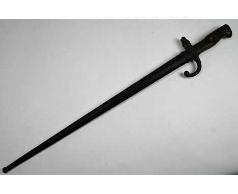 A French Infantry bayonet St Etienne 1877 pattern, the brass and steel hilt with two-piece wood grip, 52 cm blade, in steel s